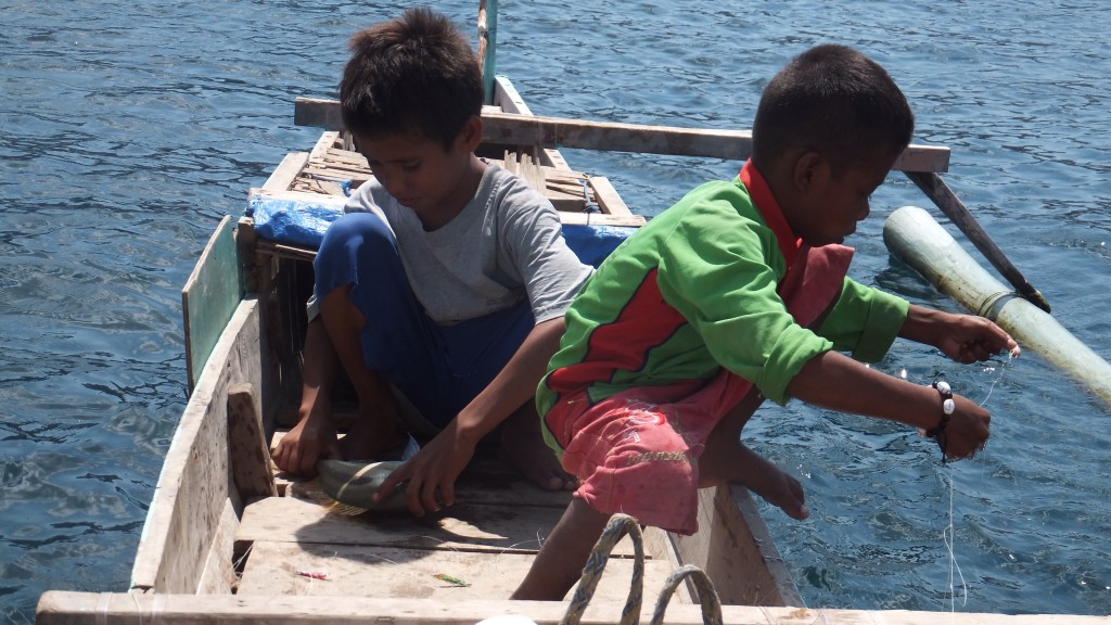 These two boys rowed over to us in their little wooden boat, one was 12 (looked about 8), his brother was 7 (looked about 5) Young looking, with an ability to fish - they seemed pleased when we purchased their catch for our dinner!